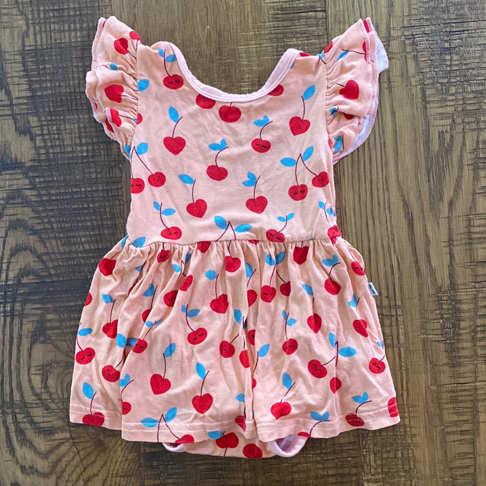 LITTLE SLEEPIES Play skirted bodysuit onesie